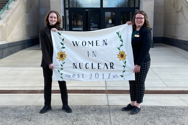 Morgan Smith and Liz Bramer standing in front of the Indiana State House in Indianapolis, Indiana.