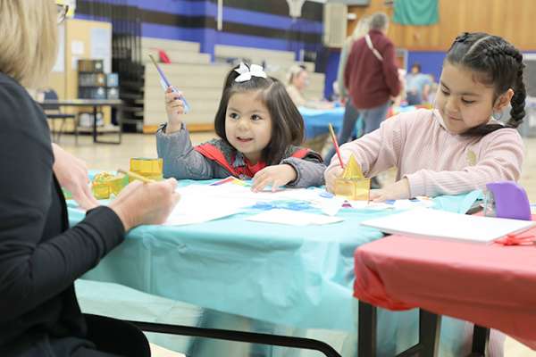 Children create science-themed art at the Kids Engineering Day event in Benton City, Washington, hosted by Energy Northwest Women in Nuclear.